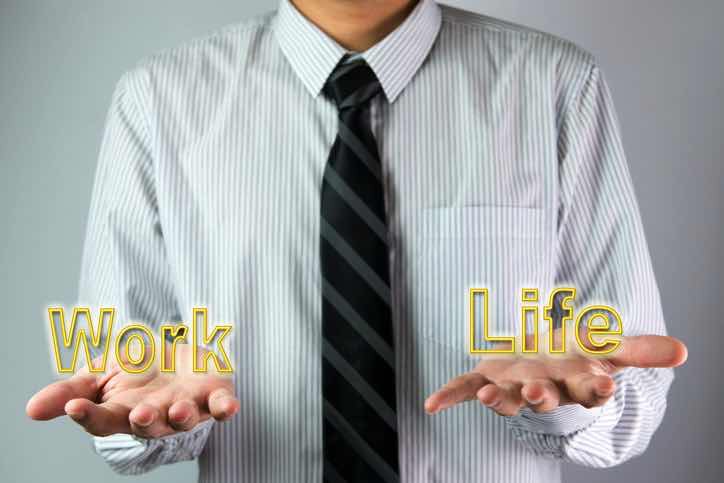 man holds balance betweeen work and life+F16