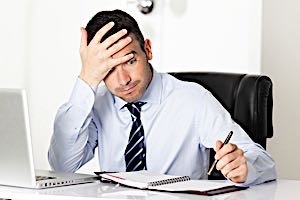 businessman having hard time solving a problem