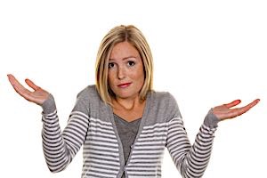 woman shruggs in frustration