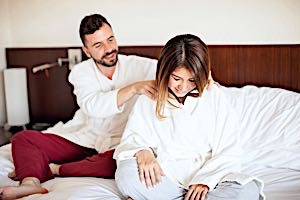 husband massaging wife's shoulders