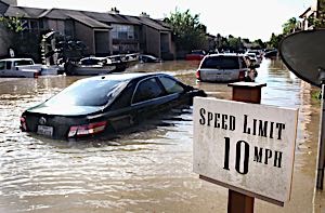 flooded street and damaged cars