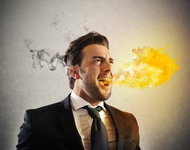 Angry man with head smoking with anger