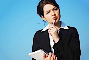 woman with pad and pen pencil thinking hard