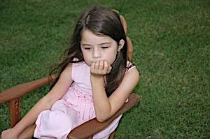 young girl with blank expression