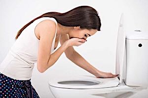 sick woman nausea vomit at toilet