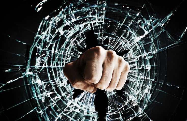 fist punched through glass in anger