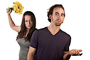 woman angry at puzzled man