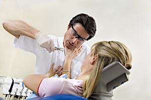 dentist attacking patient with pliers