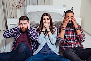 Three people covering  their ears, mouth, and eyes.