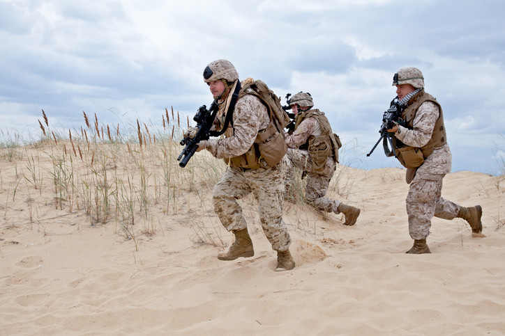 soldiers  advancing through desert