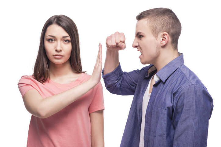 angry man yelling at woman