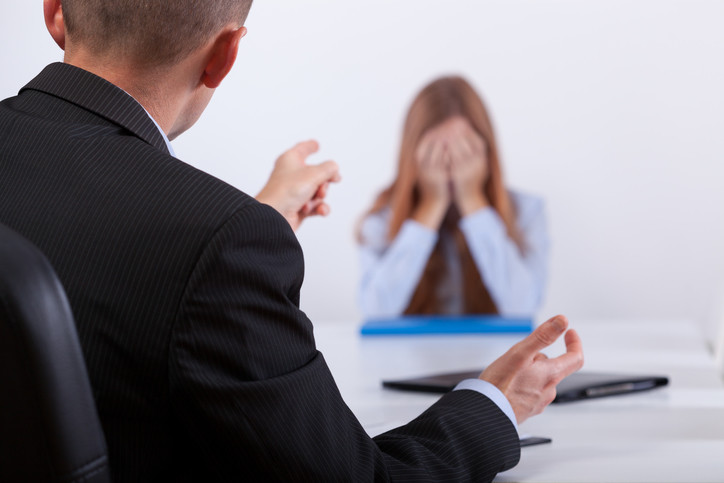 Woman crying during argument with coworker