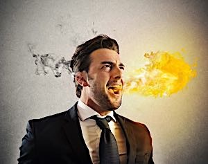 Angry violent man about to explode breathing fire and smoke