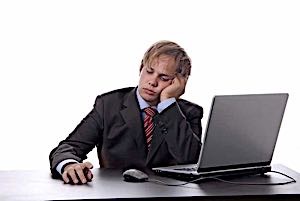 bored sleepy businessman at computer