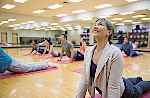 happy woman in yoga class