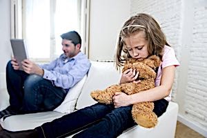 Dad is ignoring sad lonely daughter