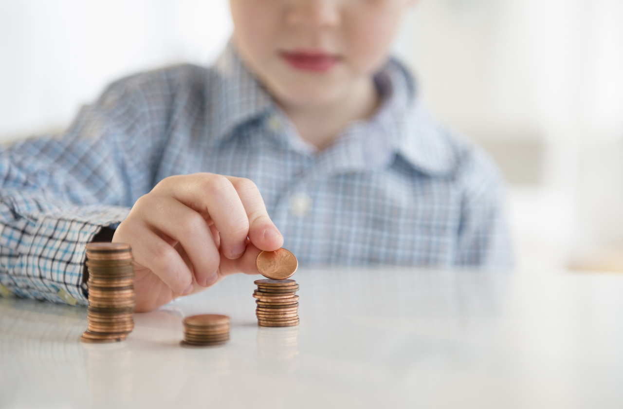 kid counting coins he has saved