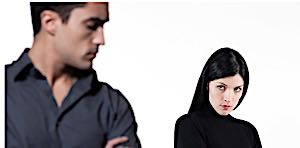man and woman look at each other with distrust