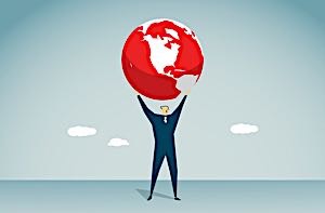 Successful happy man holding up a globe