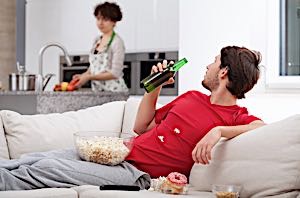 lazy boy on couch with popcorn and beer