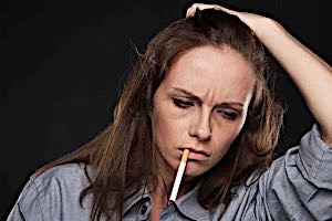 unhappy lonely angry woman smoking and thinking