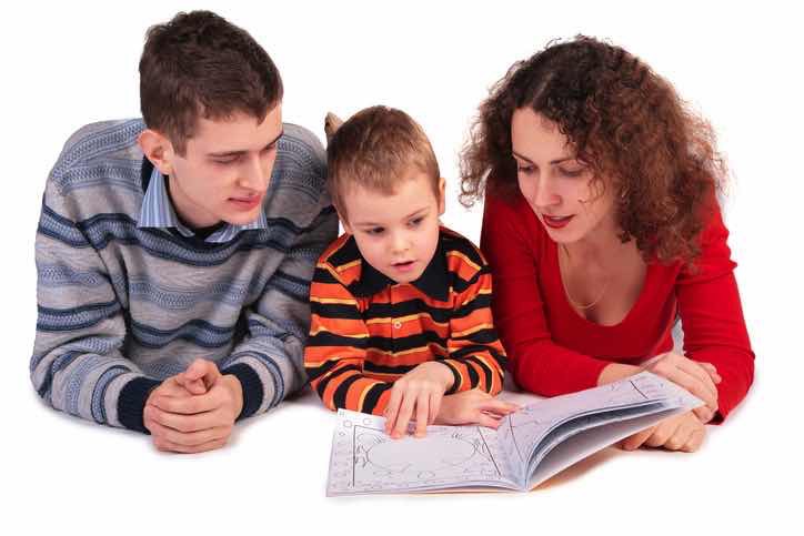 parents reading to young son