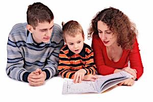 parents reading to young son