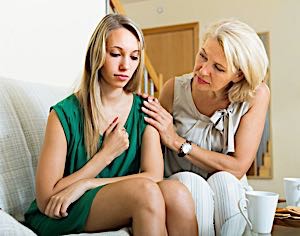 mom consoling daughter