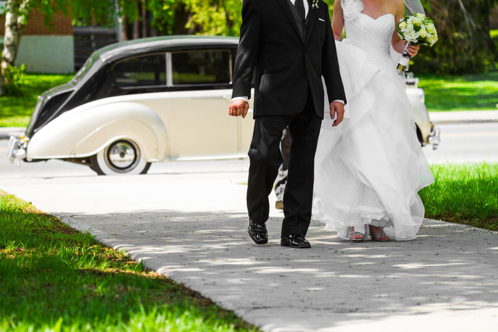 dad walks with daughter bride