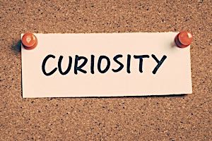 sign with text saying curiosity