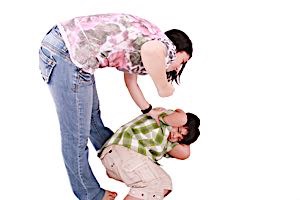 woman hitting cowering boy