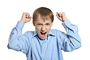 angry boy with clenched fists