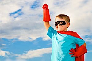 Young boy dressed in super hero costume