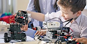 young child inventing things with toy construction kit