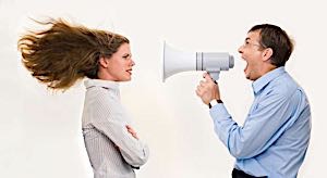 man yelling to woman with bullhorn