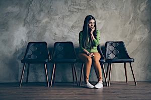 nervous woman sitting alone