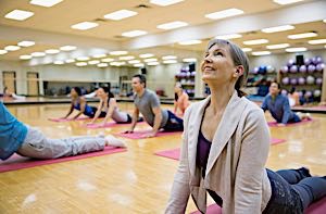 happy woman enjoying personal time at yoga class