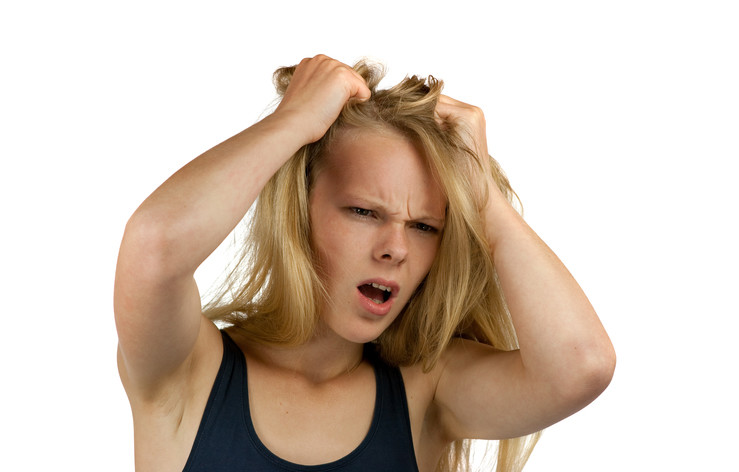 frustrated woman pulling at her hair