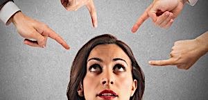 many fingers pointing to woman
