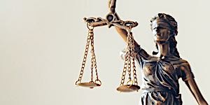 blindfolded woman holding scales of justice