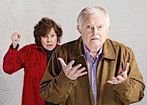 angry woman shouting at puzzled man