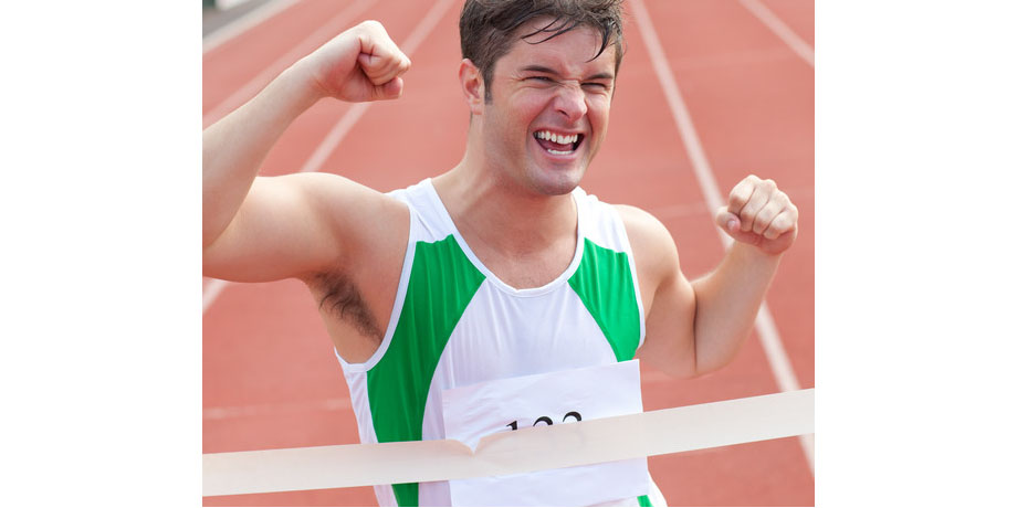 exuberant athlete crossing finish line