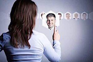 woman deciding between photos of men