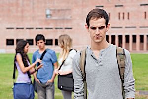 shy man avoiding interaction with two girls