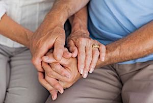 senior couple holding hands