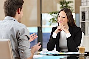 man admiring the woman therapist sitting across from him