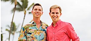 Two happy well dressed gay men