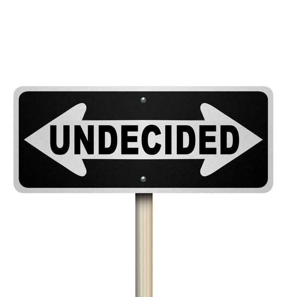 sign with arrows pointing in opposite directions with word 'undecided'