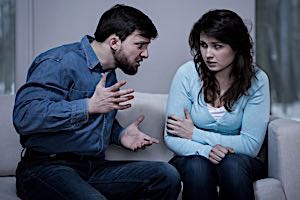 Abuse Aggressive man screaming at frightened woman
