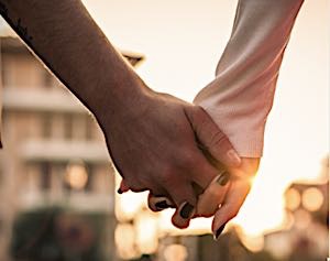 man and woman holding hands